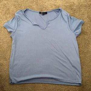Never worn light blue tee with stripe design